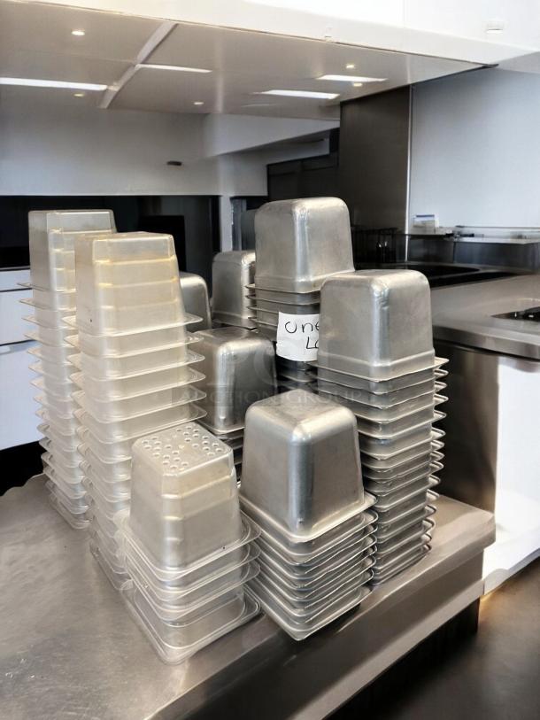 Used commercial aluminum loaf pan set, superb condition, stacked. Includes multiple pans, ready for service.