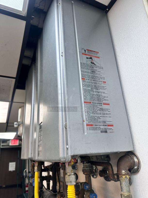 Rinnai RUC98iN tankless water heater, natural gas, superb condition, fully tested and working, detailed label visible.