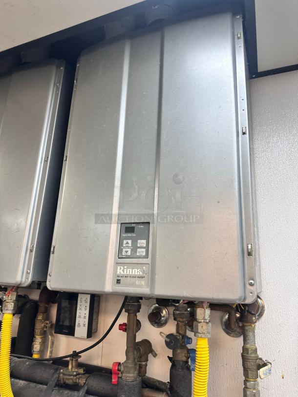Rinnai RUC98iN tankless water heater, natural gas, superb condition, fully tested, silver exterior, visible control panel.