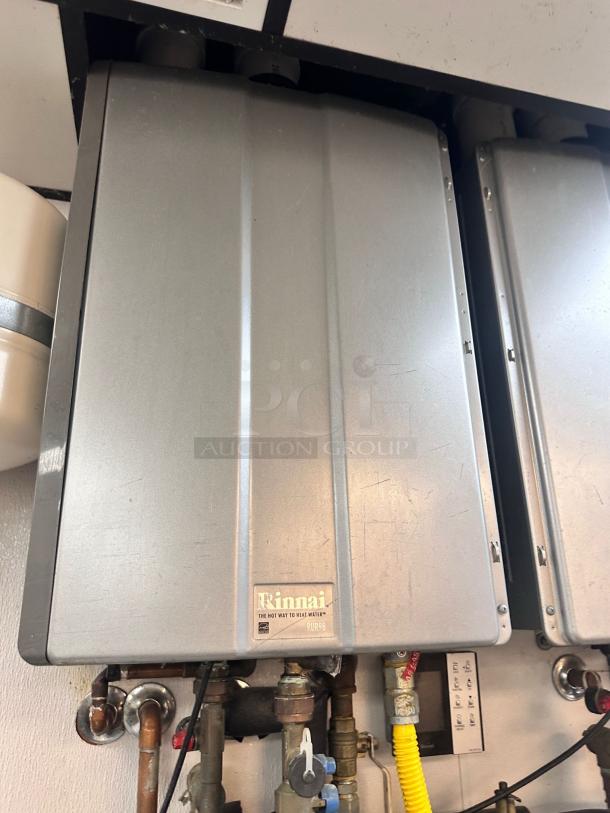 Rinnai RUC98iN tankless water heater, natural gas, superb condition, fully tested, with visible label indicating model.