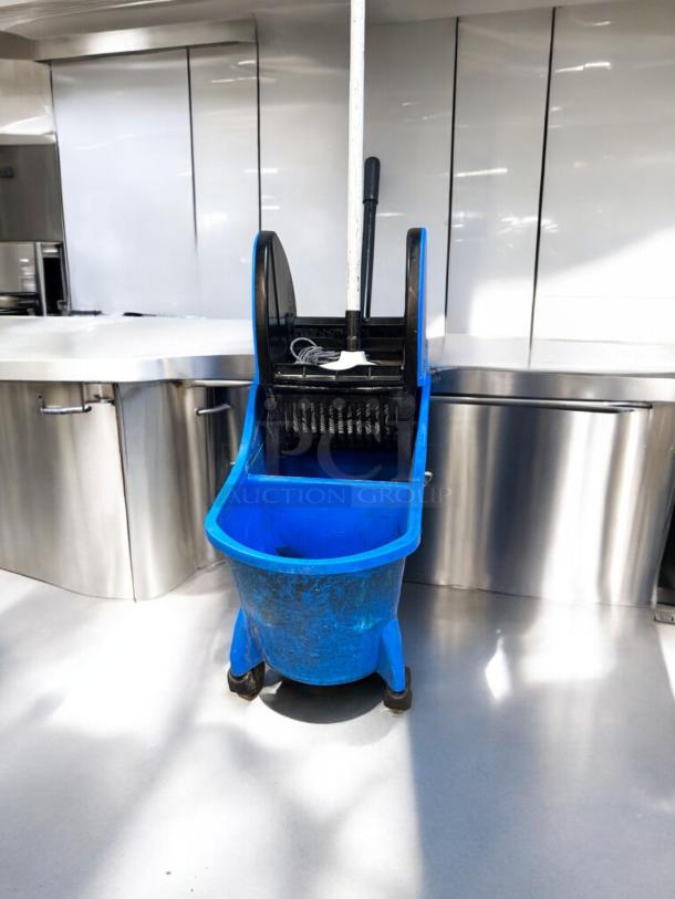 ECOLAB dual-compartment mop bucket with wringer, blue, great condition, commercial cleaning system, fully tested.