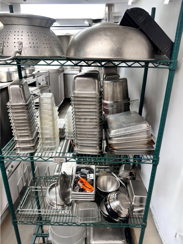 Metro-Style green wire kitchen rack with commercial pans, bowls, and tools, NSF approved, in outstanding used condition.