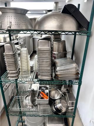 Metro-Style green wire kitchen rack with commercial pans, bowls, and tools, NSF approved, in outstanding used condition.