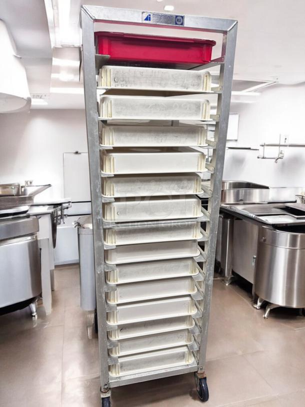 Alexander Industries full-height mobile pan rack with trays, superb condition, NSF certified, fully tested and functional.