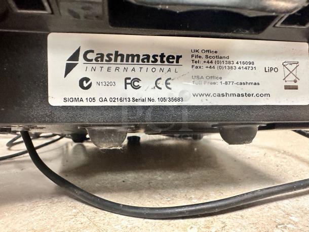 Cashmaster Sigma 105 banknote counter, model GA 0216/13, with LiPo battery. Label shows contact info and serial no. 105/35683.