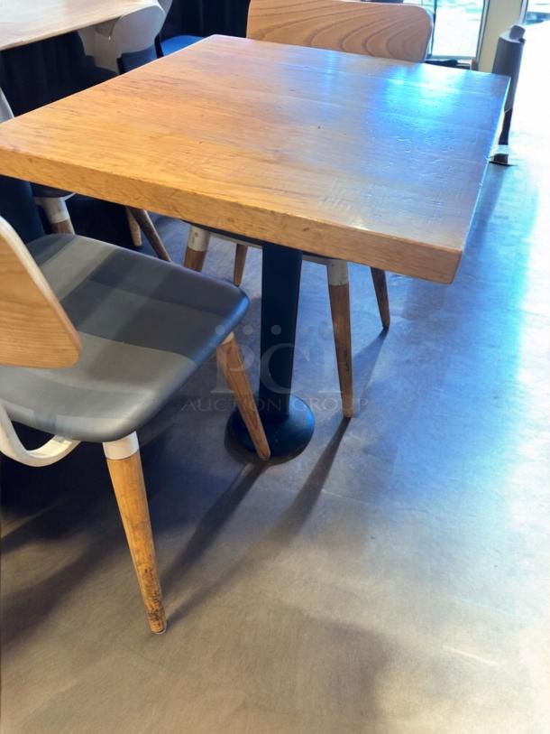 Commercial Café Table, solid wood top, steel base, 27"x24", excellent condition, durable, ideal for restaurants.