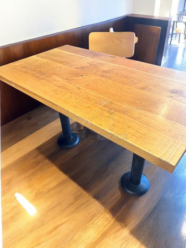 Custom commercial-grade solid wood dining table, 48"x27". Excellent condition, fully inspected, two sturdy round black legs.
