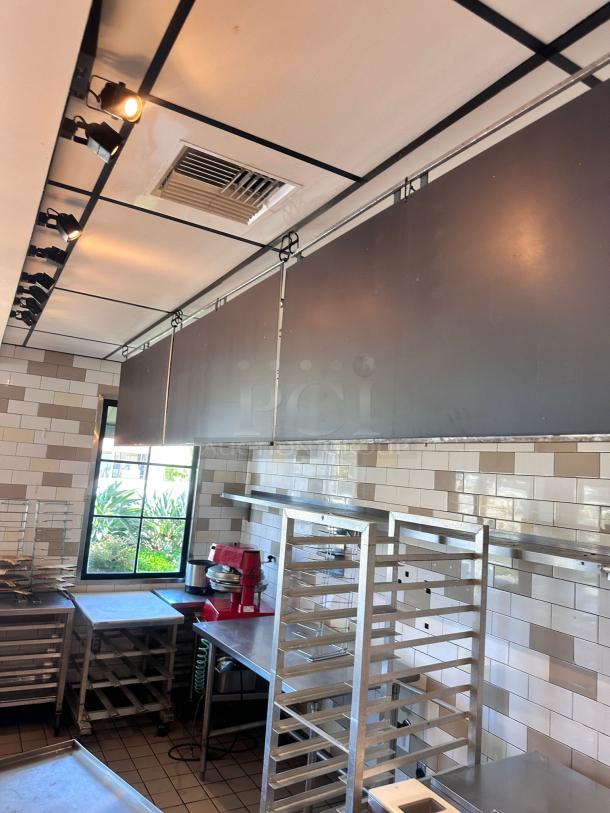 Ceiling-hung black menu boards set, 48"W x 24"H each, qty 3, top-tier condition, ideal for commercial use.