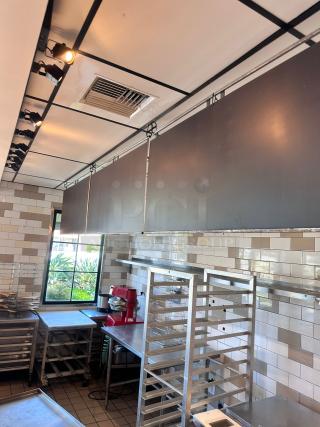 Ceiling-hung black menu boards set, 48"W x 24"H each, qty 3, top-tier condition, ideal for commercial use.