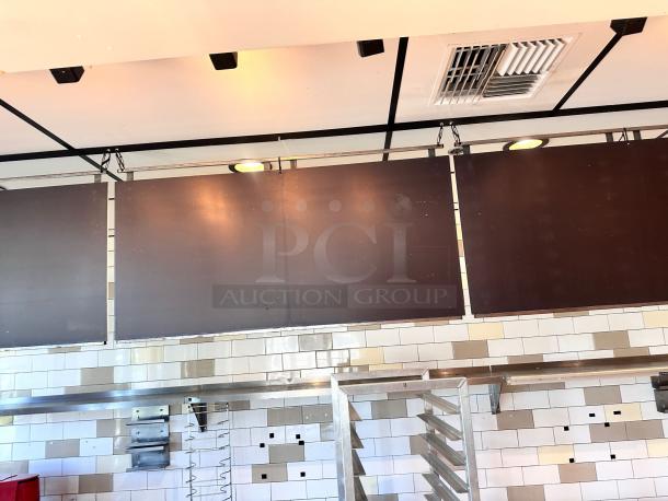Three black ceiling-hung menu boards, each 48"W x 24"H, in top-tier condition, commercial-ready.
