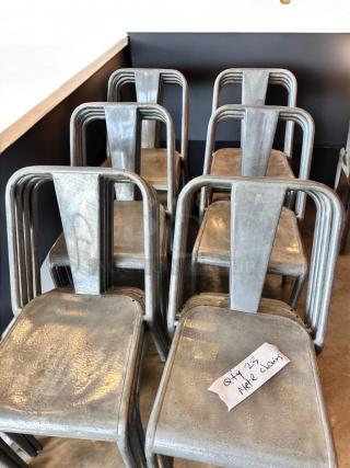 Stackable industrial metal dining chairs, immaculate condition, set of 23, commercial ready, labeled "Qty 23 Metal Chairs".