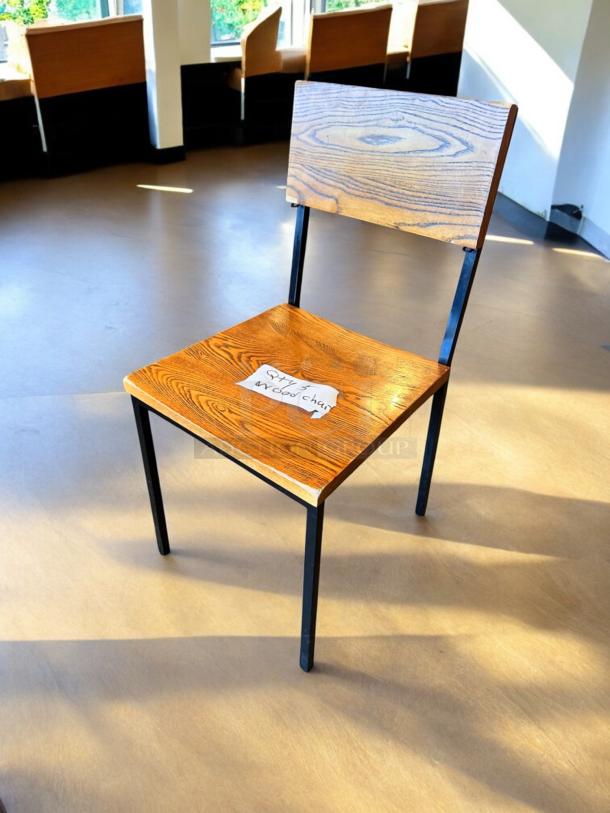 Contemporary Industrial wood dining chair with wood grain finish, black metal legs, exceptional condition. Note reads "Qty 5".