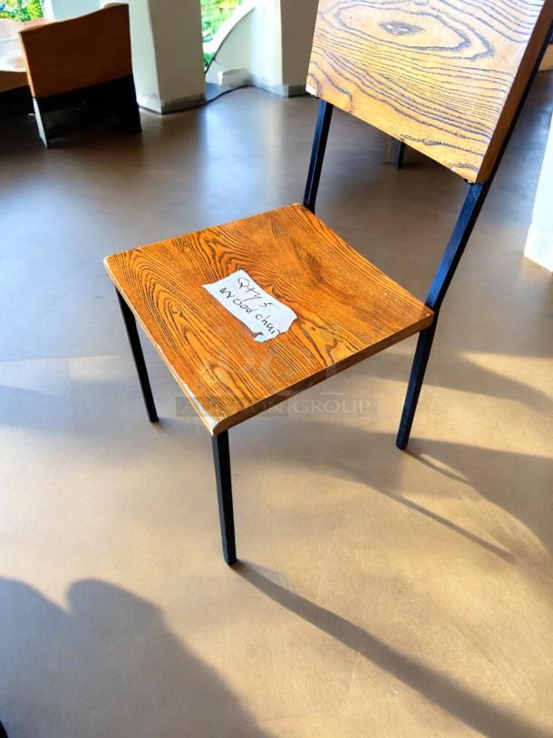 Modern wood dining chair with wood grain finish, black metal legs, in exceptional condition. Note reads "Qty 5 wood chairs."