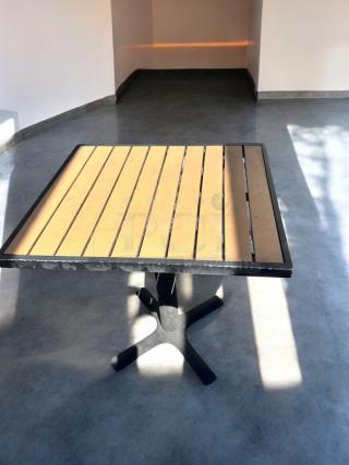 Commercial outdoor patio table, like-new condition, slatted top with heavy-duty black base, fully inspected.