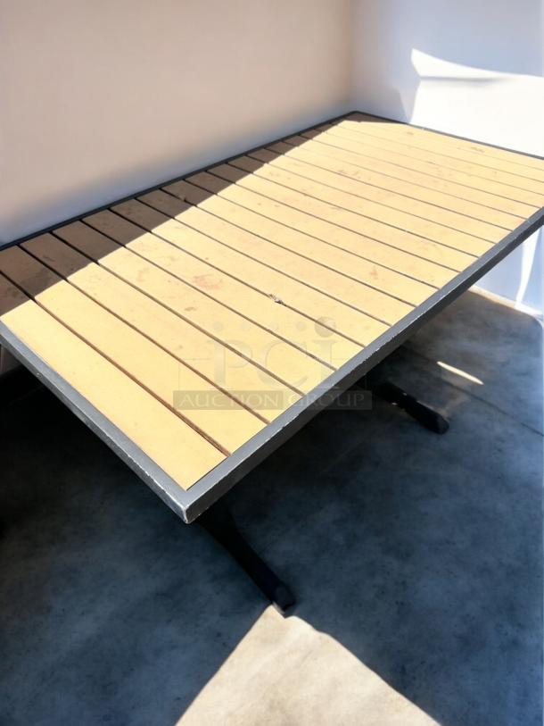LIKE-NEW Commercial patio table, slatted top, heavy-duty black base, fully inspected, ready for outdoor use.