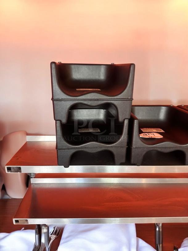 Heavy-duty black plastic restaurant booster seats, commercial grade, universal fit, stackable, easy to clean, excellent condition, quantity 4.