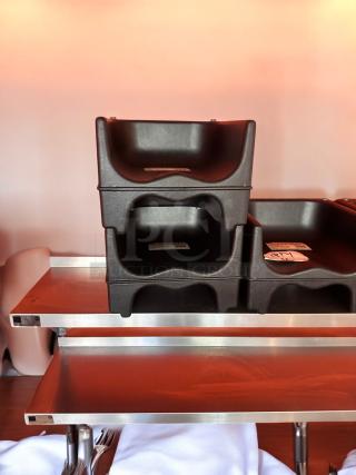 Heavy-duty black plastic restaurant booster seats, commercial grade, universal fit, stackable, easy to clean, excellent condition, quantity 4.