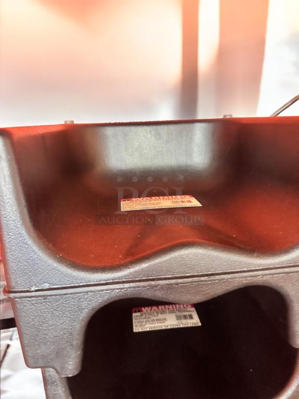 Heavy-duty restaurant booster seats in excellent condition, made of durable plastic. Stackable, easy to clean, with safety labeling. Quantity: 4. Commercial grade, universal fit.
