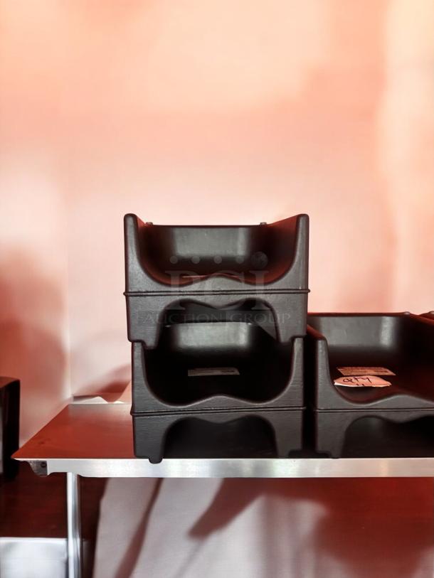 Stacked heavy-duty plastic restaurant booster seats, commercial grade, universal fit, in excellent condition. Stackable, easy to clean.