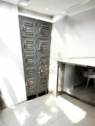Metal employee locker cabinet with 12 compartments, very good condition, model 12-Door Vertical Locker, fully functional.