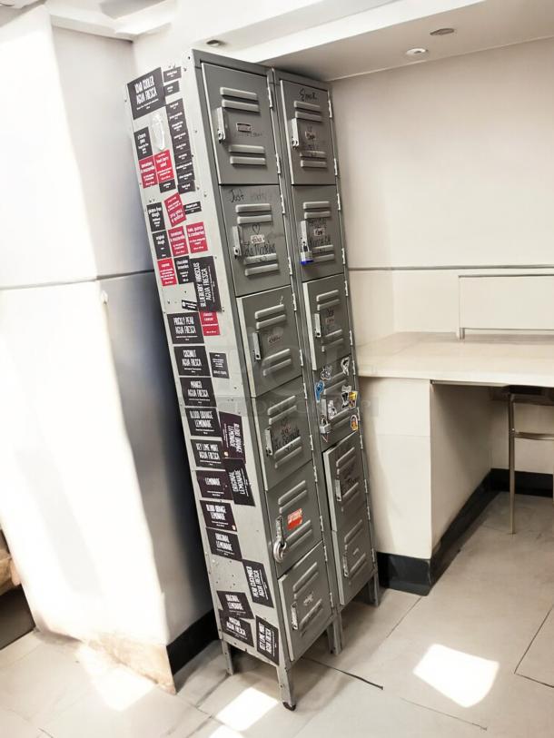 Metal employee locker cabinet, very good condition, 12 compartments, model 12-Door Vertical Locker, labeled, functional.