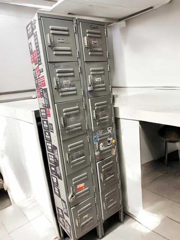 Very good condition metal cabinet with 12 compartments, model 12-Door Vertical Locker. Includes visible labels and stickers.