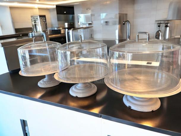 Greco 612 cake display stand with dome lid, white metal base, like-new condition, fully tested, ready to use.