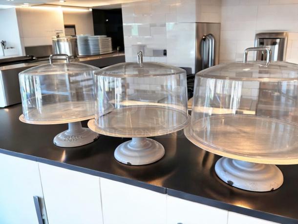 LIKE-NEW Greco 612 Cake Display with Dome Lid, white metal base, clear dome. Features Greco branding, fully tested.