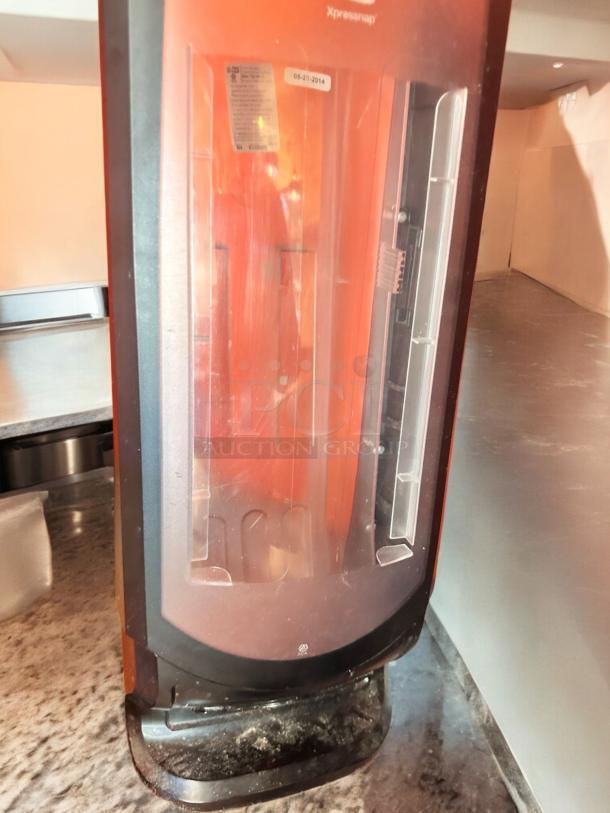 Tork Xpressnap tabletop napkin dispenser, black, fully tested, clear front panel, visible model label, very good condition.