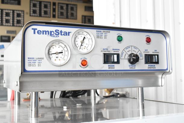 Brand new Jackson TempStar stainless steel commercial dishwasher control panel with gauges and mode settings.