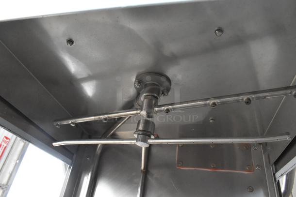Brand new 2024 Jackson TempStar stainless steel commercial dishwasher interior view, high-temp model with electric booster.