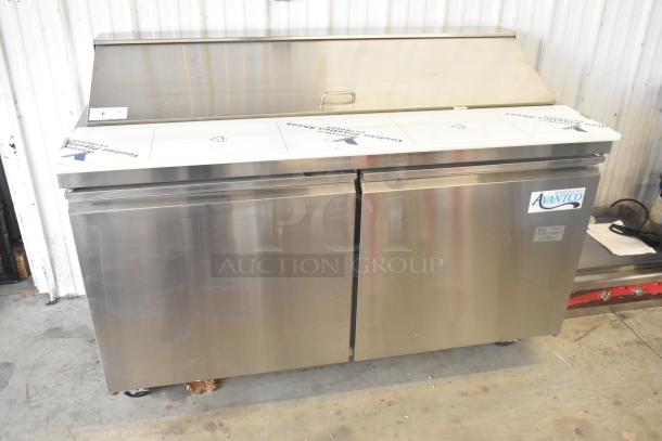Brand new Avantco 178SSPT60 stainless steel commercial sandwich salad prep table, 115V, 1 phase, on casters.