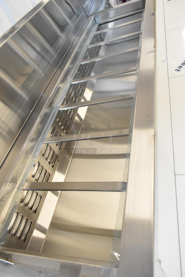 Brand new Avantco 178SSPT60 stainless steel prep table with bain marie top and commercial casters, 115V, 1 phase.