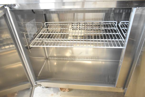 Brand new Avantco 178SSPT60 stainless steel commercial salad prep table interior with wire shelving, 115V, 1 phase, on casters.
