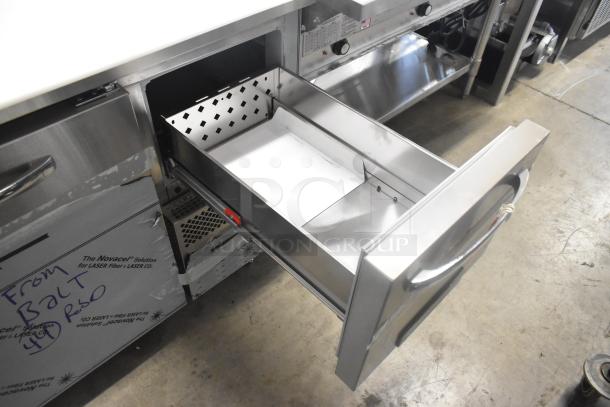Continental CPA60 stainless steel pizza prep table with open drawer, tags visible, on commercial casters, 115V, 1 phase.