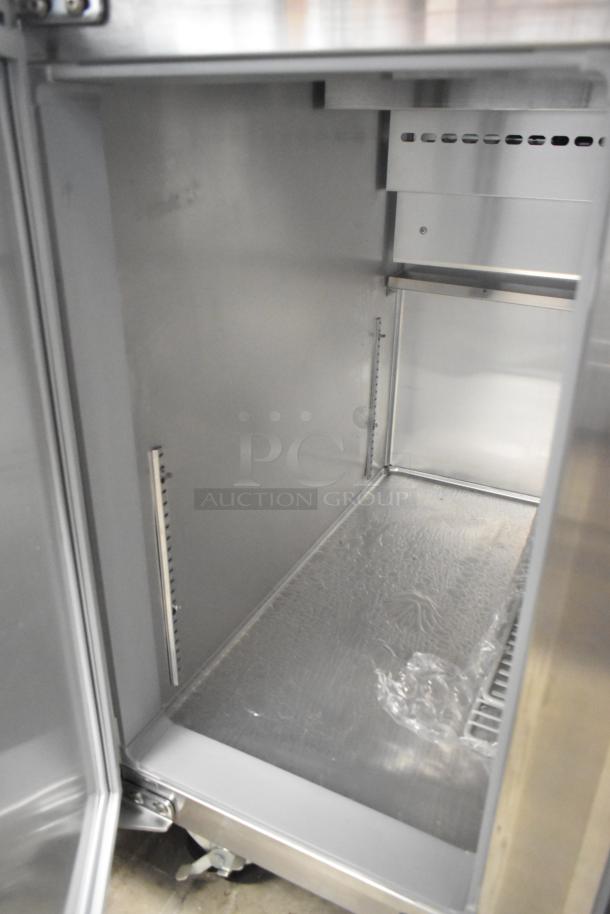 Continental CPA60 stainless steel commercial pizza prep table interior. Scratch and dent, new condition. On casters, 115V, 1 Phase.