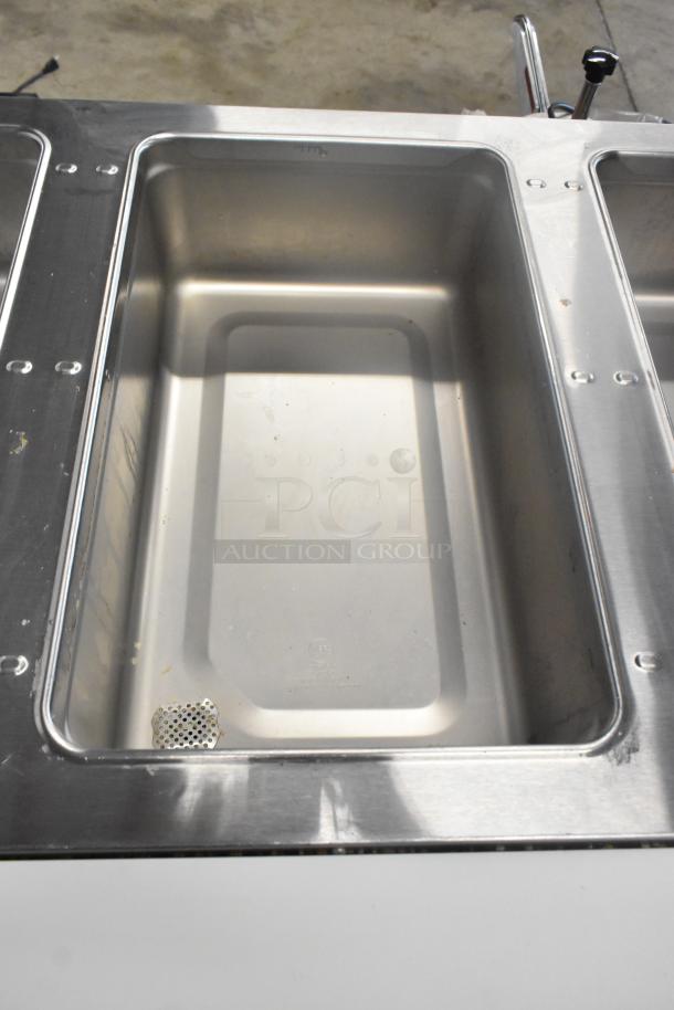 BRAND NEW Eagle SHT3-120 stainless steel 3 bay steam table. Features metal under shelf, 120 volts, 1 phase. Scratch and dent.