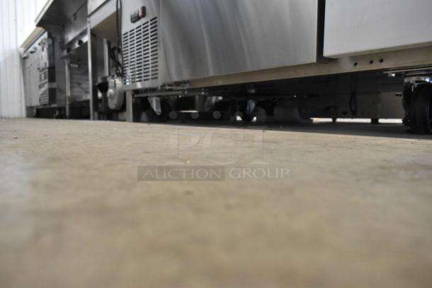 Stainless steel Avantco 178SSWD3R commercial worktop refrigerator on casters, featuring a 3.5-inch backsplash. Brand new.