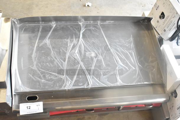 Brand new Avantco 177EG30N 30" electric countertop griddle with scratch and dent, stainless steel, 208/240V, 1 phase.