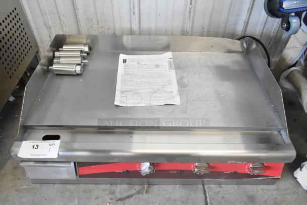 Brand new Avantco 177EG30N 30" electric countertop griddle in stainless steel. Some scratches and dents. Model tag visible.