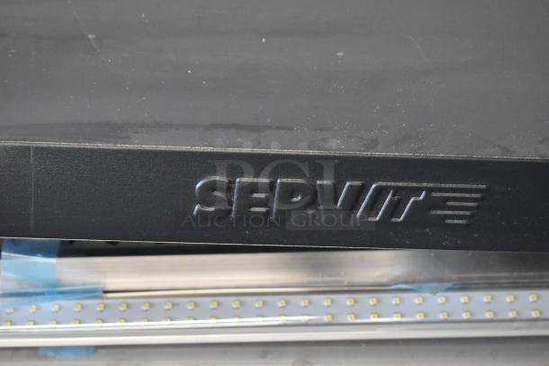 Brand new ServIt 423OAM138D 48" heated display merchandiser; black finish, visible ServIt logo, slight surface scratches.
