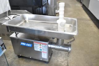 BRAND NEW Pro-Cut KG-12-SS #12 Stainless Steel Electric Meat Grinder, 120V, 1 Phase, with visible label and warning stickers.