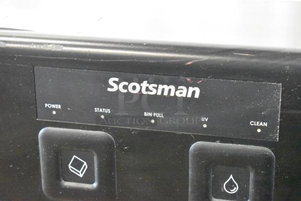 Scotsman HID207ABX-1A ice machine control panel with power, status, bin full, UV, and clean indicators.