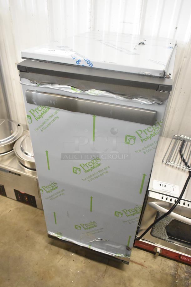 Brand new 2023 Manitowoc UCP0050A-161 undercounter ice machine, 25 lb. bin, 52 lb. capacity, visible dents, protective wrap.