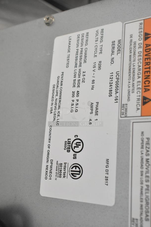Alt text: Manitowoc UCP0050A-161 ice machine label, showing model, serial number, voltage, and certification marks.