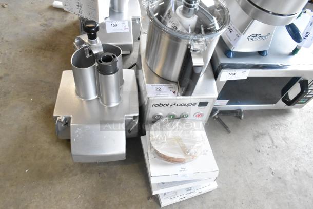 Brand new Robot Coupe R 702 food processor with 1/8" slicing disc, dice cleaning kit, and grating disc. 208-240V, 3 Phase.