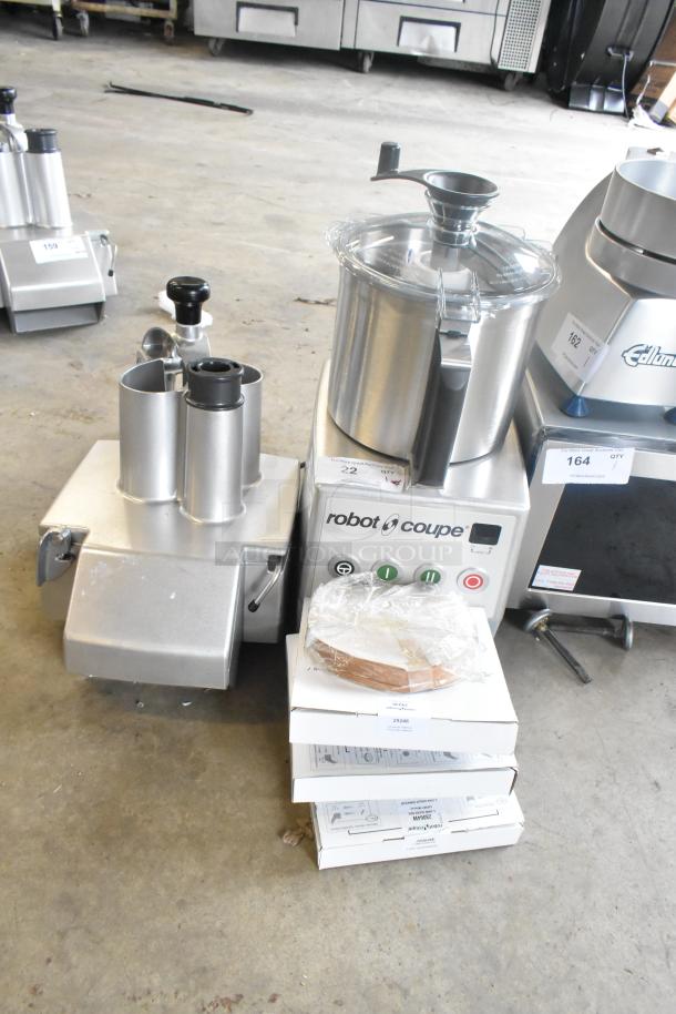 Brand new Robot Coupe R 702 8 Qt. food processor. Includes 1/8" slicing disc, dice cleaning kit, 1/8" grating disc.