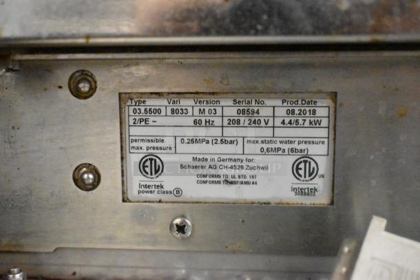 Schaerer Barista stainless steel 2-group espresso machine label, showing model, voltage, and production details. Signs of wear visible.