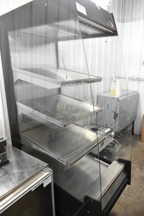 BKI HSS2-4T metal 3-tier open grab-n-go heated merchandiser on casters, 208V 1 phase, clean condition with clear glass panels.