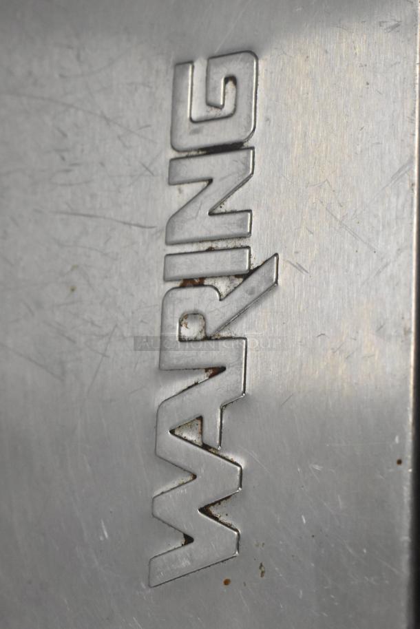Waring WPG250 stainless steel panini press with visible brand logo. 120 volts, 1 phase. Used condition.